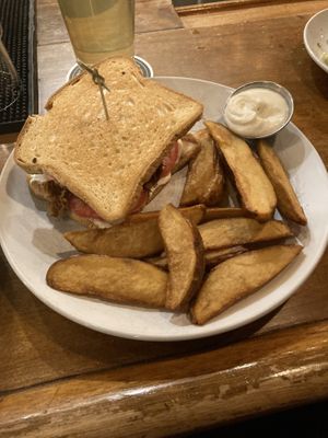 Gluten free Cuban sandwich with extra crispy wedges  at Reverie Cafe + Bar in Minneapolis