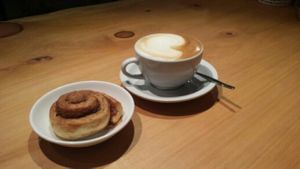 Coffee and cinnamon bun at Naturalley Organic Cafe in Dunedin