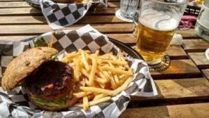 black bean & seitan burger with fries. pint of black isle blonde at Lucky Pig - Paradise Palms in Edinburgh