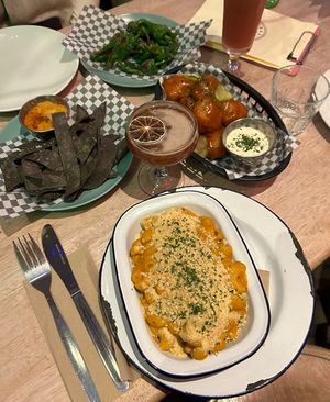 Padron peppers, buffalo cauliflower, macaroni, blue tortilla chips with cheese sauce  at Lucky Pig - Paradise Palms in Edinburgh