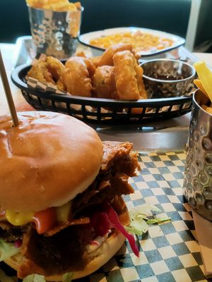 BBQ brisket burger, mac n cheese, and onion rings at Lucky Pig - Paradise Palms in Edinburgh
