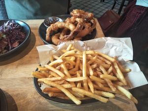 Fries and battered onion rings at Lucky Pig - Paradise Palms in Edinburgh