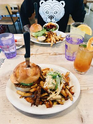 The Main Burger with Cheddar Cheese and Teem Poutine & The Double Double with Fries and Salad  at MeeT in Gastown in Vancouver