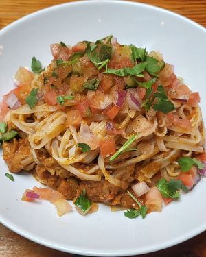 Butter Chikkin Noodz for $14.50 during happy hour at MeeT in Gastown in Vancouver