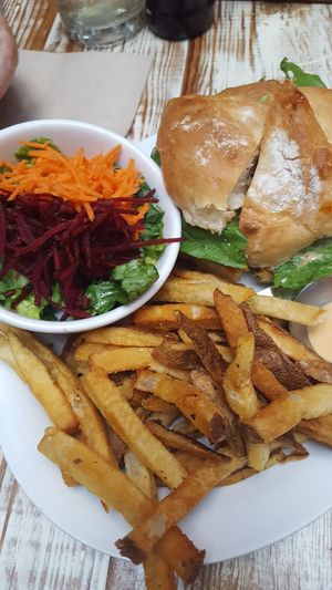 Crispy bbq burger with fries and salad at MeeT in Gastown in Vancouver