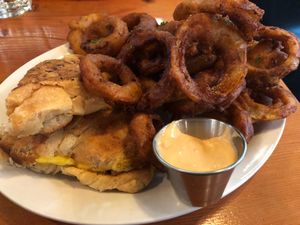 Onion rings with a side of featured Croissant-wich  at MeeT in Gastown in Vancouver