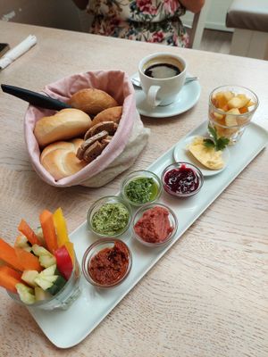 breakfast "Kleeblatt" with margarine, spreads, jam, fruit salad, veggie sticks & one coffee included (17.50€) - pictured bread/rolls are meant for 2 breakfasts at Cafe Glück in Fulda