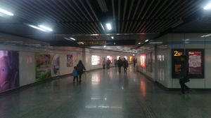 Trailblazing Pic#2-4: The front view to the Exit 2, with the ticket vending machine on the left side. Then go straight to the bottom of the hall where escalators & staircase await leading up to the Exit 2. at Super Vegan - Huang Pu District in Shanghai