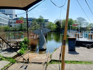 Outside by the water at Cafe De Ceuvel in Amsterdam