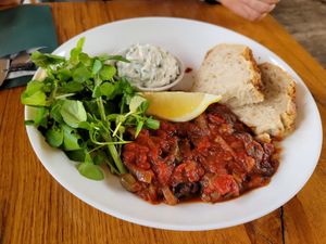 Eggplant in tomatosauce, bread, tzatziki, salad without dressing … 14,50€  at Cafe De Ceuvel in Amsterdam