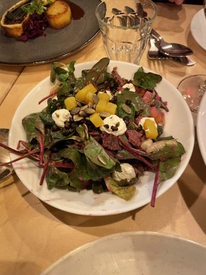 Red beet salad (mushroom Wellington in the background)  at Cafe De Ceuvel in Amsterdam