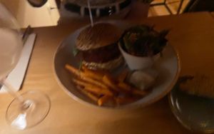 Hardly visible but the homemade burger with sweet potato fries   at Eetcafe Ceramique in Maastricht