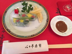 Spring Rolls (wrapped in rice paper) There is raw cucumber, edible flowers and shiso inside. Very fresh. My favorite course.  at SinSinTei in Nagoya