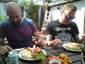 Happy vegans in the garden of Cafe So Vegan at Royal Sovereign Pub in East London