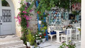 Breakfast under pomegranate tree at Ruzgar Hotel in Alacati