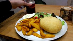 Fried vegan burger with aioli, salad and potatoe wedges at Marla & Mathilda's Genusswerkstatt in Ludenscheid