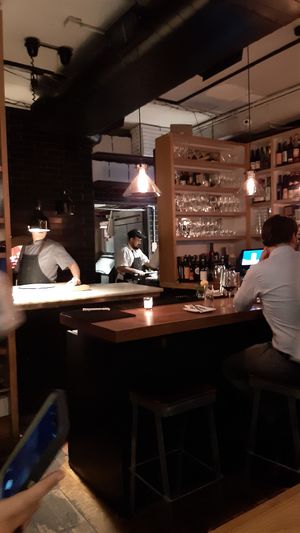 Kitchen and serving area with bar at Double Zero in New York City