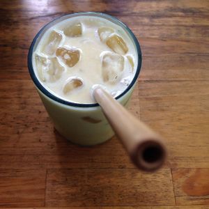 iced turmeric ginger cashew milk latte  at ARTillery in Siem Reap