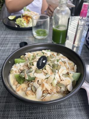 Mango Smoothie Bowl with Granola at Veganerie Concept - Benjasiri Park in Bangkok