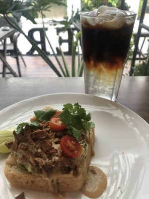 Avo smash with crispy bacon and coconut coffee  at Veganerie Concept - Benjasiri Park in Bangkok