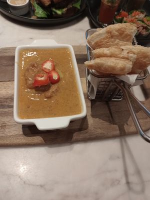 Massaman curry and baked roti. at Veganerie Concept - Benjasiri Park in Bangkok