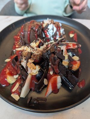 Waffle with ice cream, chocolate and strawberry sauces at Veganerie Concept - Benjasiri Park in Bangkok