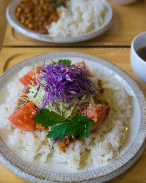Vegan taco rice (front) and curry rice (behind) with side soups. at Musubi Cafe in Kyoto