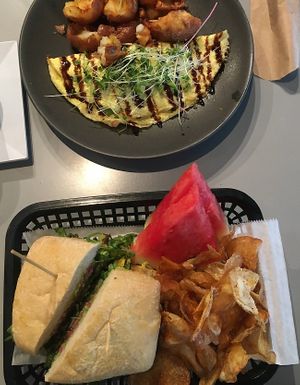 garden sammie with chips and seasonal fruit (bottom plate)   at Local Foods - The Village in Houston
