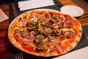 Pizza Capricciosa 'vegan style' = without cheese and with cherry tomatoes instead of ham at manin in Saarbrucken