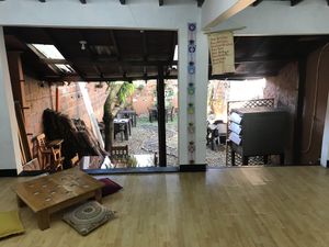 Outdoor seating area at back at Tulsi Plant Based in Envigado