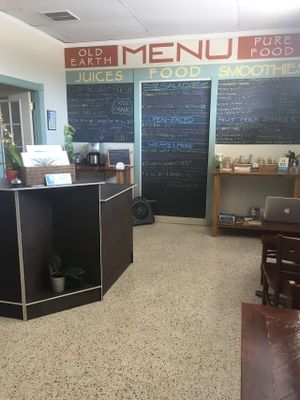 Small but comfortable storefront with two tables. at Old Earth Pure Organic Food in St Petersburg