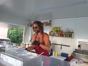 Gyros guy preparing food during heatwave at The Green Market Berlin in Berlin