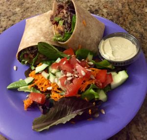 Giddy-Up Wrap w/ Quinoa & Spring Mix and Side Salad. at Dandelion Community Cafe in Orlando