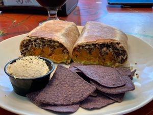 Sweet potato burrito with a side of hummus  at Dandelion Community Cafe in Orlando