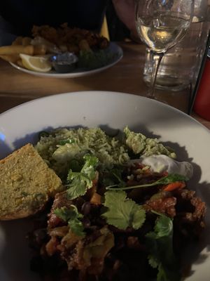 Delicious chilli, green rice, corn bread, guacamole   at Cafe Van Gogh in South West London