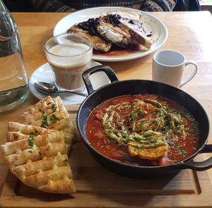 Front: shakshuka: back: french toast. And coffee at Cafe Van Gogh in South West London