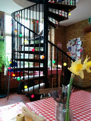 stairs to upstairs seating at Cafe Van Gogh in South West London