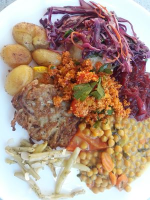 potato pancakes, beans, chickpeas,  couscous salad,  red cabbage salad, baked potatoes at Lepione in Wroclaw
