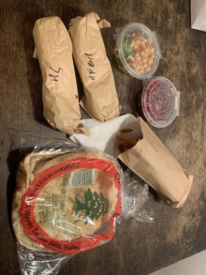 Chickpea-Salad, Feetroot-Salad, 2x Harissa-Falafel-Wraps, Fries, the bread is served to every Salad  at Habeez - Rüttenscheid in Essen