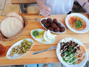 2 different types of hummus, falafel and flatbreads at The Hummus of Tahini in Jerusalem