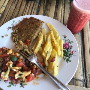 Hamburguesa vegano! Patty made with lentils and spice went well with saucy stir fried veg at Cafe Mar in Puerto Lopez