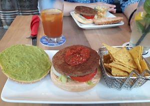Burger with tortilla chips at Cafe Blattgold in Kiel