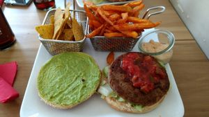 TexMex burger with nachos and sweet potato fries at Cafe Blattgold in Kiel