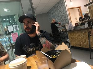 Cool cats eating and rocking their phones at Rabbits Cafe in Portland