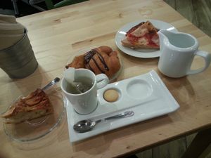 apple cake, chocolate brioche croissant, pizza and tea at Canape Incontro in Bologna