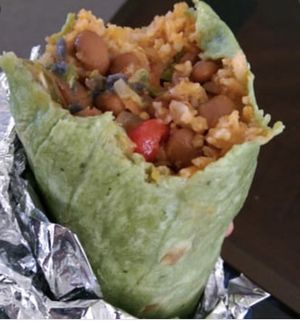 Spanish rice and pinto beans with vegetables in a spinach tortilla at Freebirds World Burrito in Midland