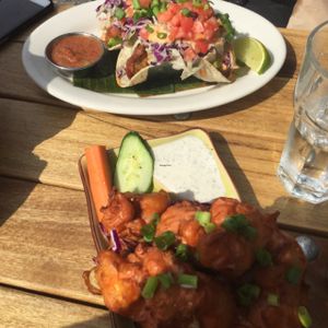 buffalo cauliflower wings and the fried avocado tacos. yum! at No Bones Beach Club in Seattle
