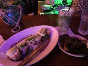 Grilled volcano roll and taro cakes at No Bones Beach Club in Seattle