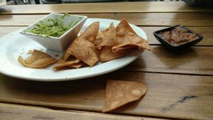 Half eaten chips, guac, salsa at No Bones Beach Club in Seattle
