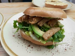 Chicken and avocado bagel with rocket and salsa verde mayo at Hyde Park Book Club in Leeds